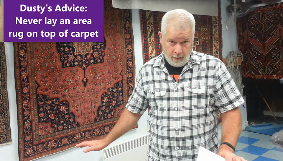 why area rugs curl - laying on a carpet